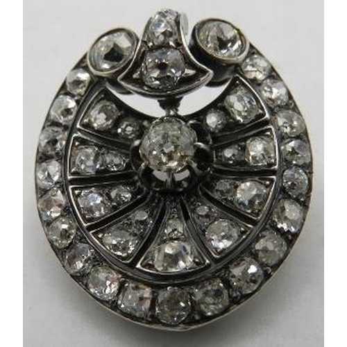 390 - A fine early Victorian silver & gold diamond brooch of pierced palmette design, set throughout with ... 