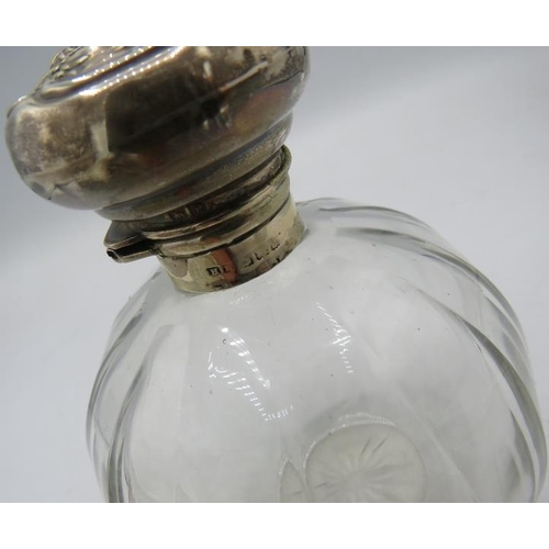 399 - A heavy cut glass circular scent bottle with silver hinged top & inner stopper, London 1921. Another... 