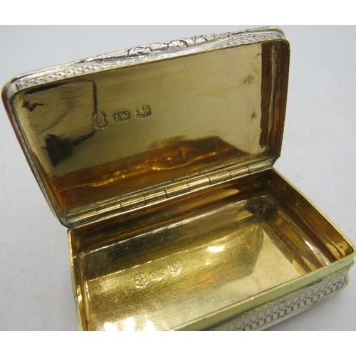 404 - A Georgian silver snuff box with cast floral mounts & gilded interior, Birmingham 1822. Approx 6cm a... 