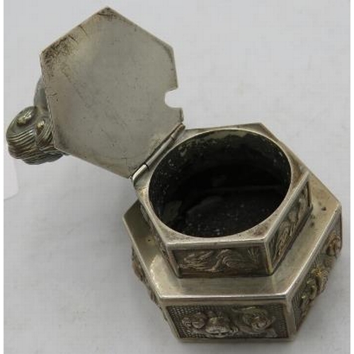 407 - A white metal hexagonal Chinese hinged snuff box with a Dog of Fo top and applied dragons & Dogs of ... 