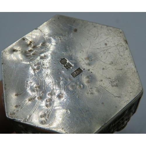 407 - A white metal hexagonal Chinese hinged snuff box with a Dog of Fo top and applied dragons & Dogs of ... 