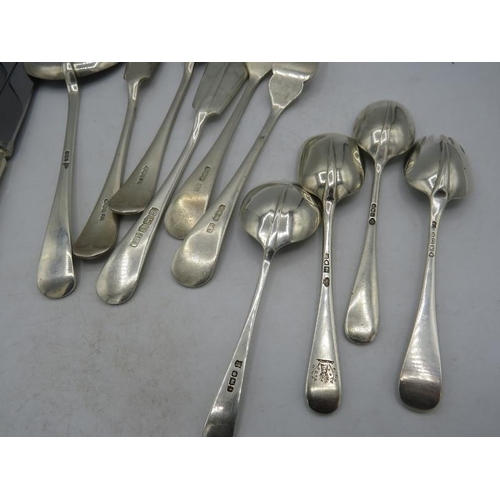 410 - An assortment of silver flatware with various hallmarks, four unmarked dinner knives and an unmarked... 