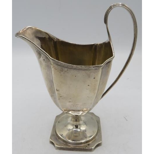 437 - A Georgian silver cream jug on a pedestal, London 1832. Approx 6