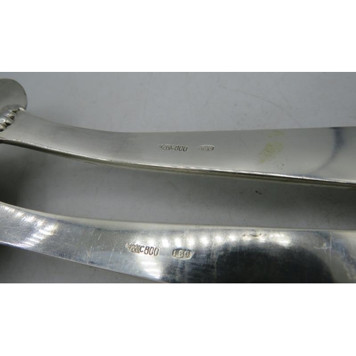 444 - A heavy 800 stamped serving spoon and fork, marked MC. Approx weight 8 troy oz/265 grams.
Condition ... 