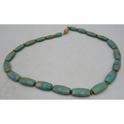 471 - An unusual graduated 'Kingman' turquoise necklace. The centre faceted oblong bead is approx 10mm x 2... 