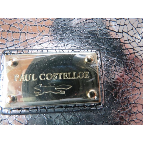 484 - A large Paul Costelloe handbag with silver crackle metallic decoration and added shoulder strap, wit... 