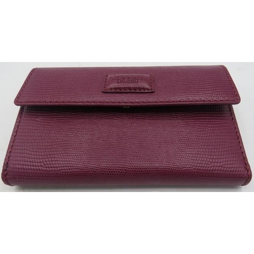 494 - Osprey, London, leather maroon wallet/purse, boxed.
Provenance: Part of a private collection of desi... 