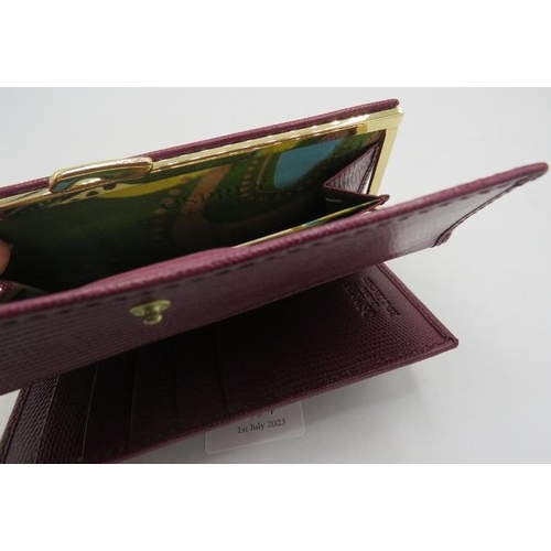 494 - Osprey, London, leather maroon wallet/purse, boxed.
Provenance: Part of a private collection of desi... 