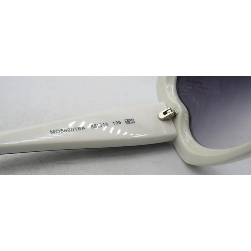 496 - A pair of black reverse heart sunglasses with white edging, cased.
Provenance: Part of a private col... 