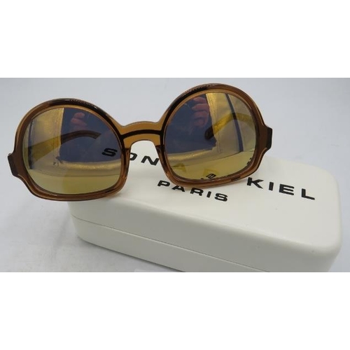 497 - Sonia Rykiel golden reflective sunglasses, Paris, cased.
Provenance: Part of a private collection of... 