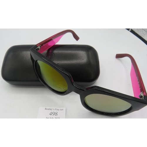 498 - Alexander McQueen black sunglasses with pink and black arms, cased.
Provenance: Part of a private co... 