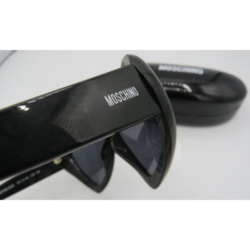 500 - Moschino black heart shaped sunglasses, cased.
Provenance: Part of a private collection of designer ... 