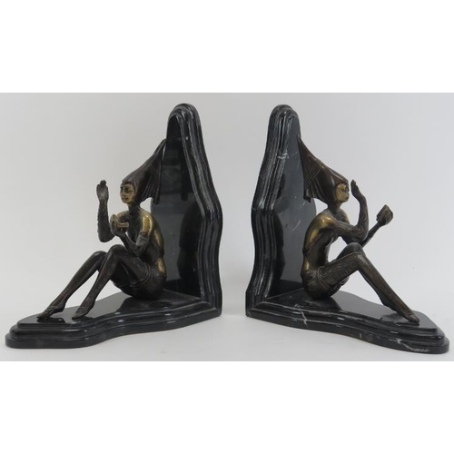 61 - A pair of Art Deco bronze and black variegated marble book ends modelled after Josef Lorenzl. The ma... 