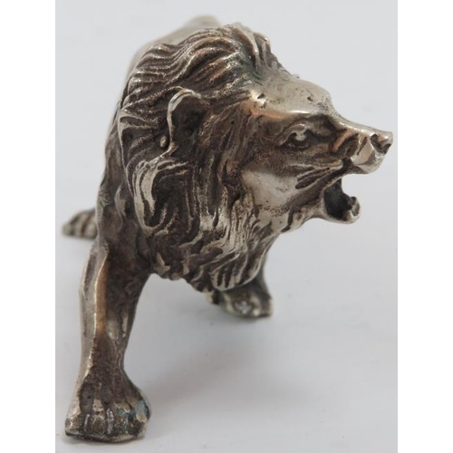 79 - A European silver plated metal lion, probably 19th century. 5.7 in (14.5 cm) length. 
Condition repo... 