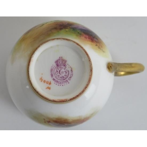 82 - A Royal Worcester gilt polychrome painted porcelain coffee cup and saucer, circa 1914. With a gilt i... 