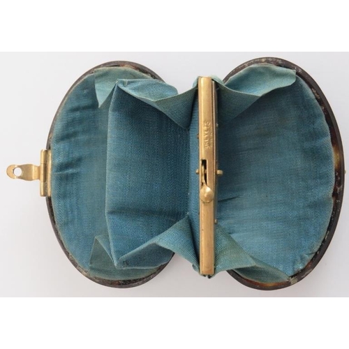 84 - A gilt metal and abalone piqué worked tortoiseshell purse, 19th century. Of oval form with a teal si... 