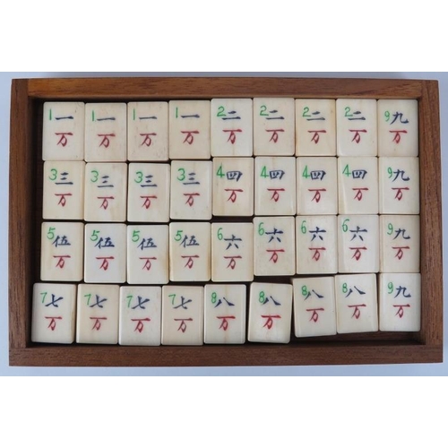 92 - A Chinese bone and bamboo Mahjong set, 20th century. Housed within a five draw box with four players... 