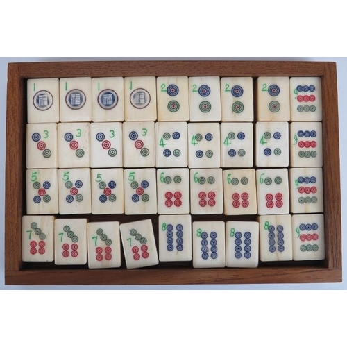 92 - A Chinese bone and bamboo Mahjong set, 20th century. Housed within a five draw box with four players... 