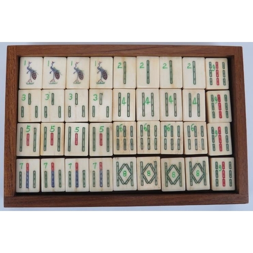 92 - A Chinese bone and bamboo Mahjong set, 20th century. Housed within a five draw box with four players... 