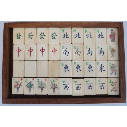 92 - A Chinese bone and bamboo Mahjong set, 20th century. Housed within a five draw box with four players... 