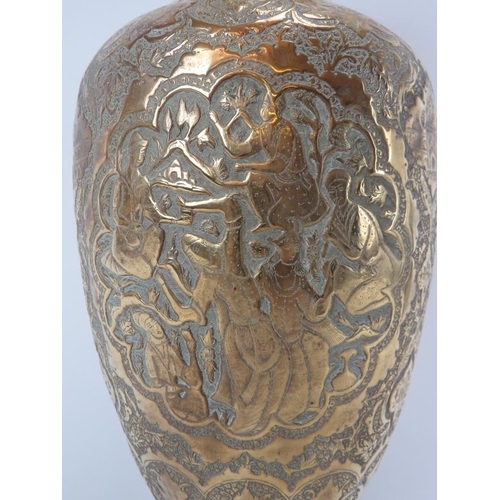 97 - A North Indian Mughal embossed brass vase, 19th century. Of ovoid form, decorated with a variety of ... 