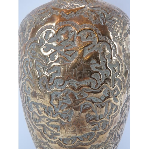 97 - A North Indian Mughal embossed brass vase, 19th century. Of ovoid form, decorated with a variety of ... 