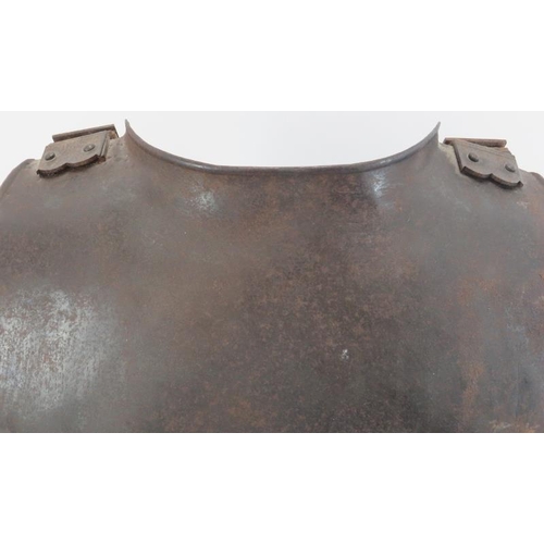 99 - An English wrought iron back plate, probably mid 17th century. Very similar to English armour exampl... 