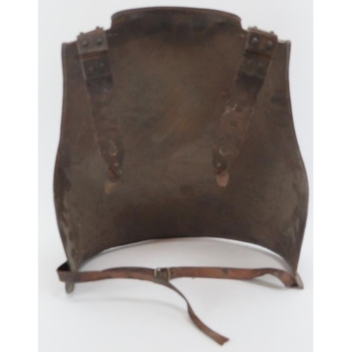 99 - An English wrought iron back plate, probably mid 17th century. Very similar to English armour exampl... 