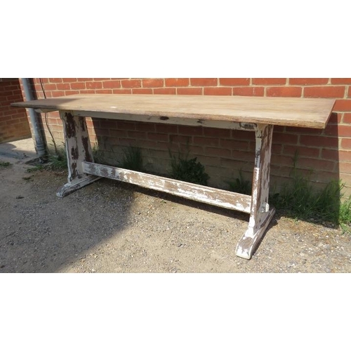 701 - A vintage limed oak refectory table, on rail supports with a middle stretcher painted distressed whi... 