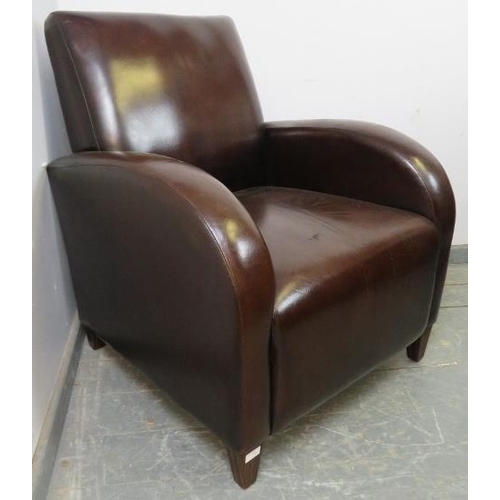 709 - An Art Deco style club armchair, upholstered in brown leather, on tapering square coromandel support... 