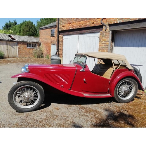 710 - A 1948 MG TC 1250cc roadster, the cranberry red coachwork complimented by a contrasting oatmeal hide... 