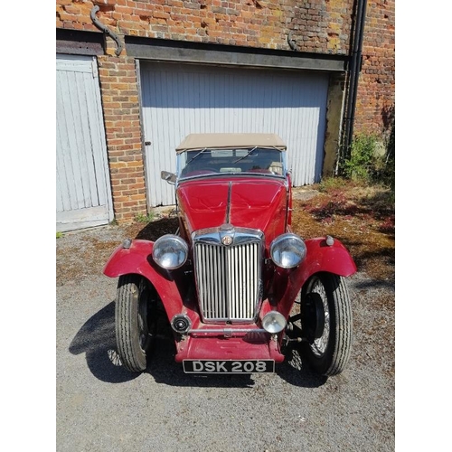 710 - A 1948 MG TC 1250cc roadster, the cranberry red coachwork complimented by a contrasting oatmeal hide... 