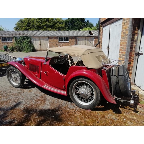 710 - A 1948 MG TC 1250cc roadster, the cranberry red coachwork complimented by a contrasting oatmeal hide... 