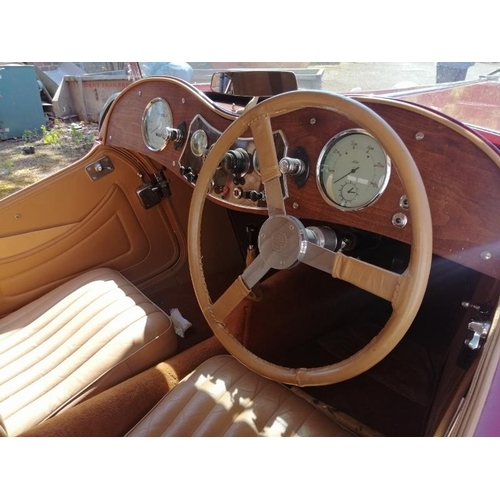 710 - A 1948 MG TC 1250cc roadster, the cranberry red coachwork complimented by a contrasting oatmeal hide... 