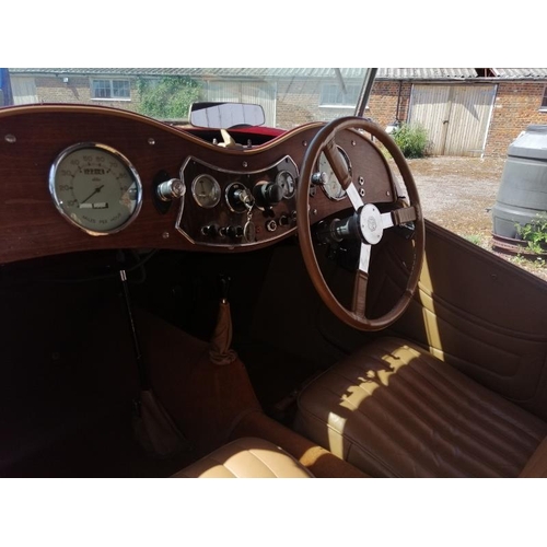 710 - A 1948 MG TC 1250cc roadster, the cranberry red coachwork complimented by a contrasting oatmeal hide... 