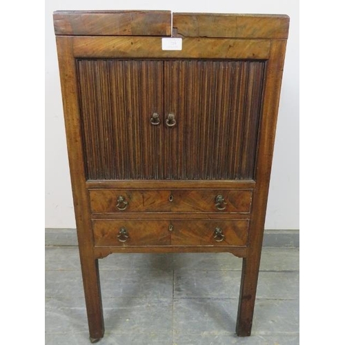 719 - A George III mahogany gentleman’s vanity unit, the doors opening onto a fitted interior with rising ... 