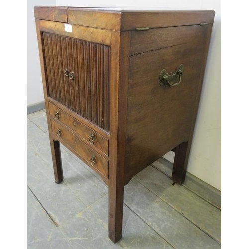 719 - A George III mahogany gentleman’s vanity unit, the doors opening onto a fitted interior with rising ... 