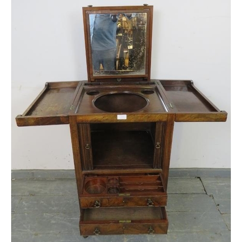 719 - A George III mahogany gentleman’s vanity unit, the doors opening onto a fitted interior with rising ... 