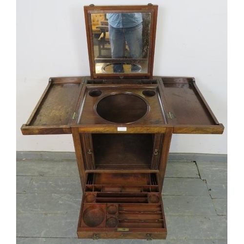 719 - A George III mahogany gentleman’s vanity unit, the doors opening onto a fitted interior with rising ... 