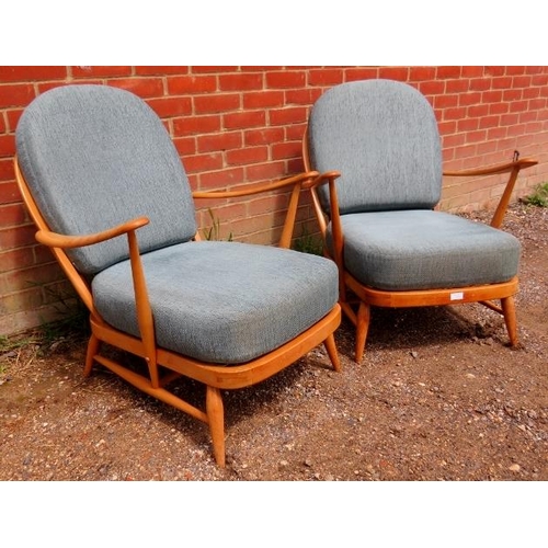 721 - A pair of mid-century elm and beech open sided Windsor armchairs by Ercol (model 203) with loose cus... 