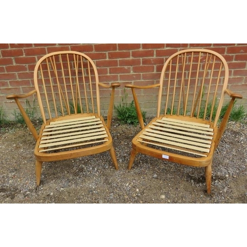 721 - A pair of mid-century elm and beech open sided Windsor armchairs by Ercol (model 203) with loose cus... 