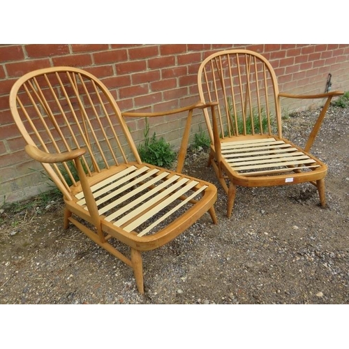 721 - A pair of mid-century elm and beech open sided Windsor armchairs by Ercol (model 203) with loose cus... 