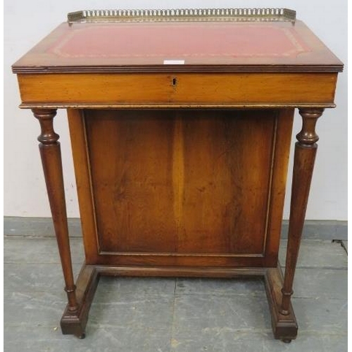 724 - A reproduction Yew wood Davenport, with brass ¾ gallery and inset red leather writing surface, housi... 