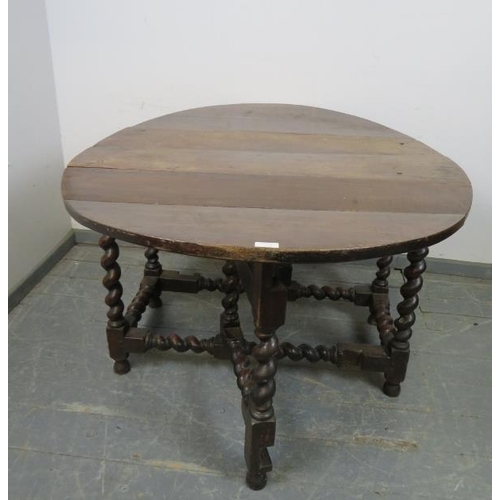 735 - A late 17th/early 18th century oak oval gate-leg table, with single drawer to either side, on barley... 