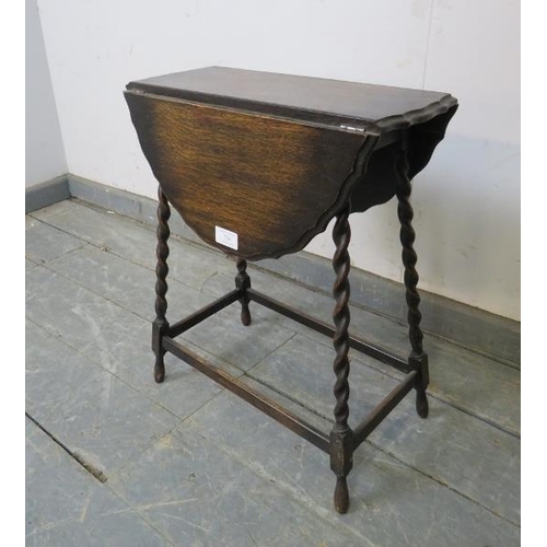 744 - A diminutive antique oak oval drop-leaf side table, on canted barley twist supports with stretchers.... 