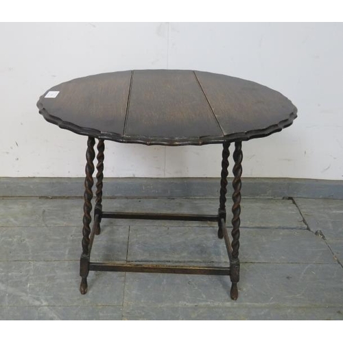 744 - A diminutive antique oak oval drop-leaf side table, on canted barley twist supports with stretchers.... 