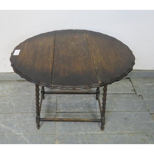 744 - A diminutive antique oak oval drop-leaf side table, on canted barley twist supports with stretchers.... 