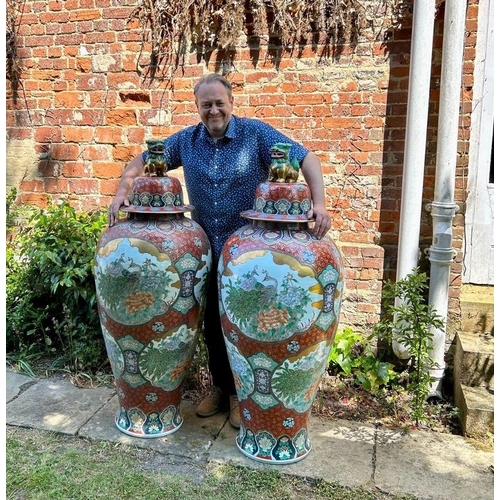 751 - A pair of very large Chinese ceramic vases with covers, 20th century. The lids modelled as Buddhisti... 