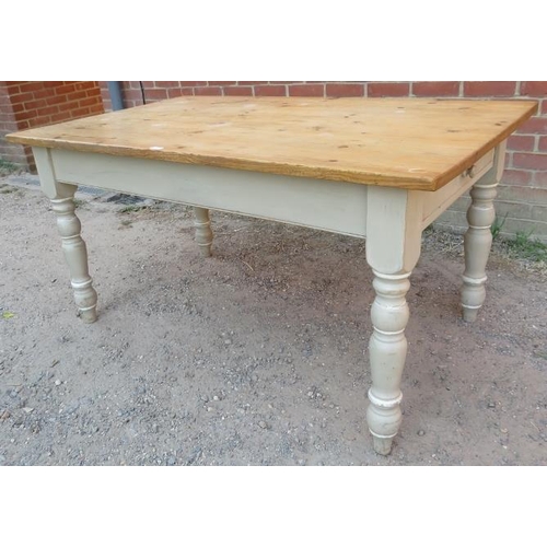 753 - A stripped pine farmhouse kitchen table, with long drawer to one side, on baluster turned supports p... 