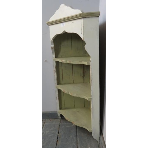 758 - A pine wall-hanging corner shelving unit, of three open fitted shelves, painted distressed Annie Slo... 